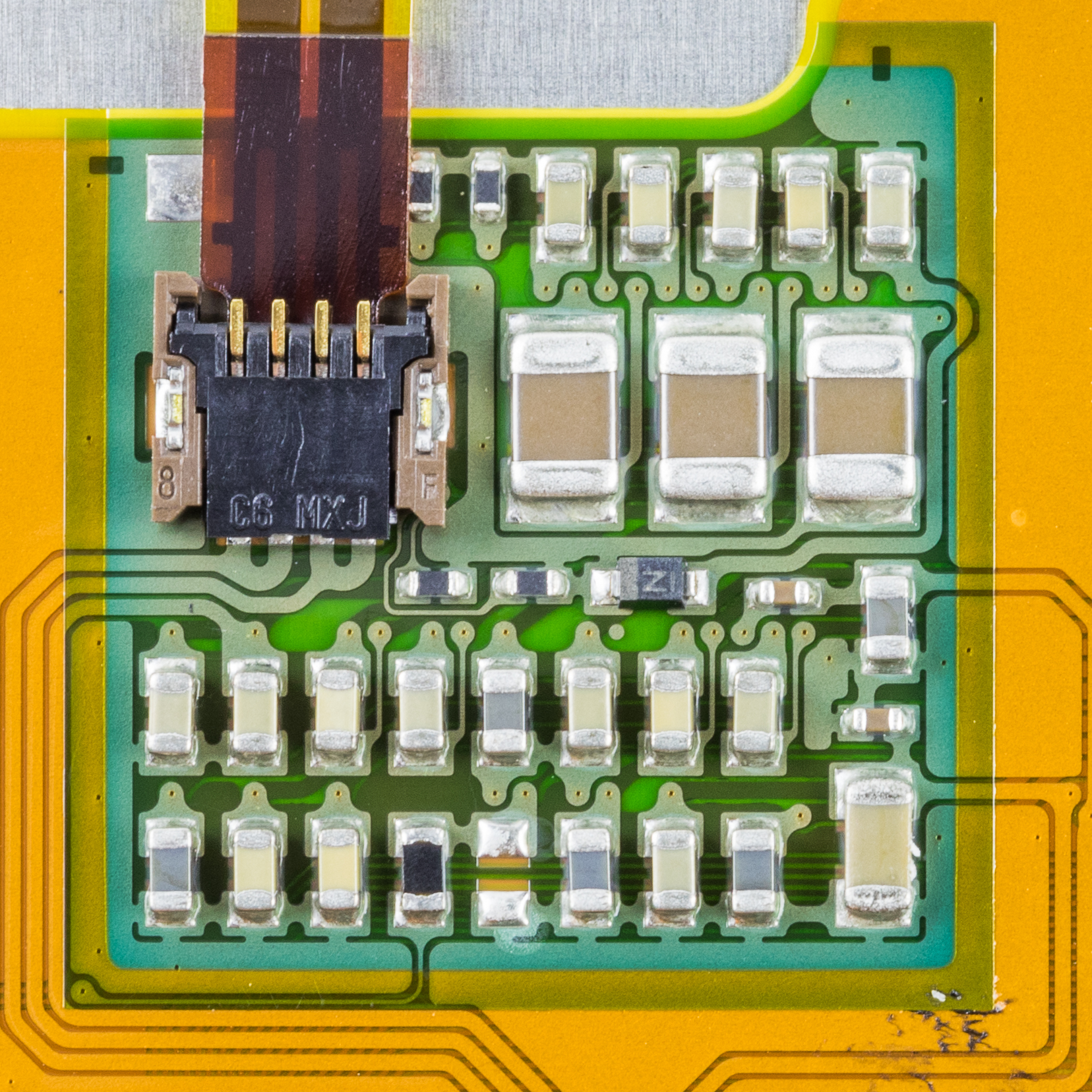 Rows of multilayer ceramic capacitors soldered on a board